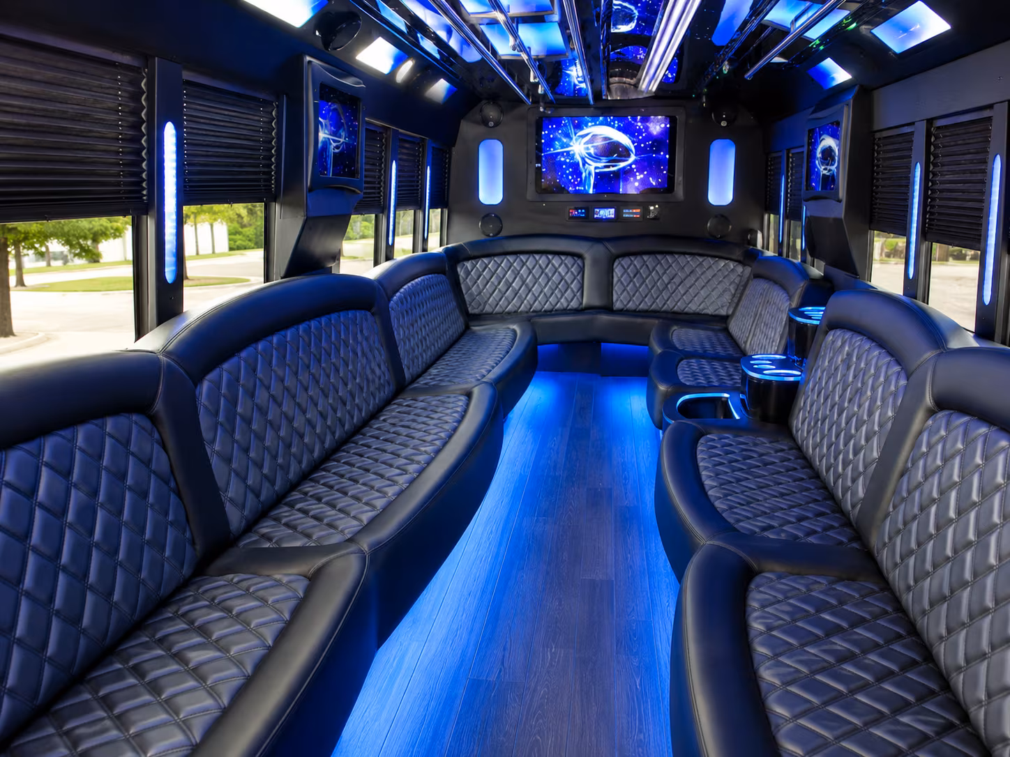 Wedding guests seated inside a party bus serving Fort Collins